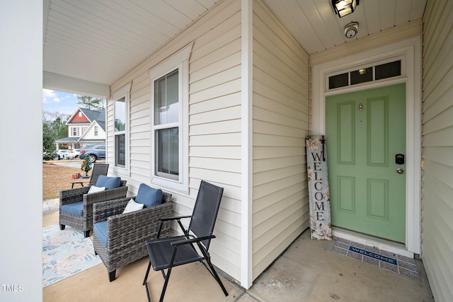 view of exterior entry featuring a porch