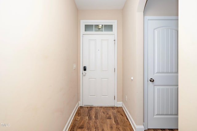 entryway with dark hardwood / wood-style floors