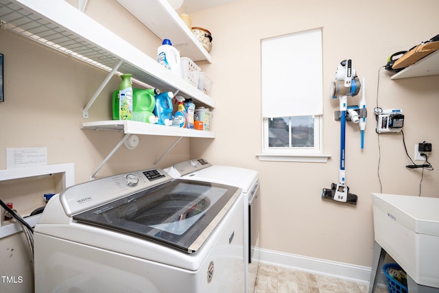 laundry room featuring sink and washing machine and clothes dryer