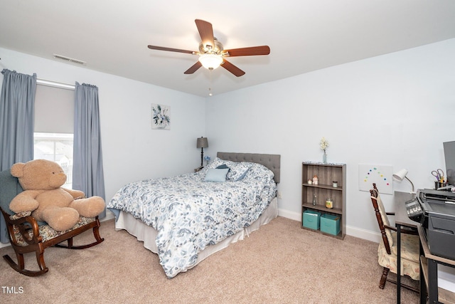 bedroom with ceiling fan and carpet floors