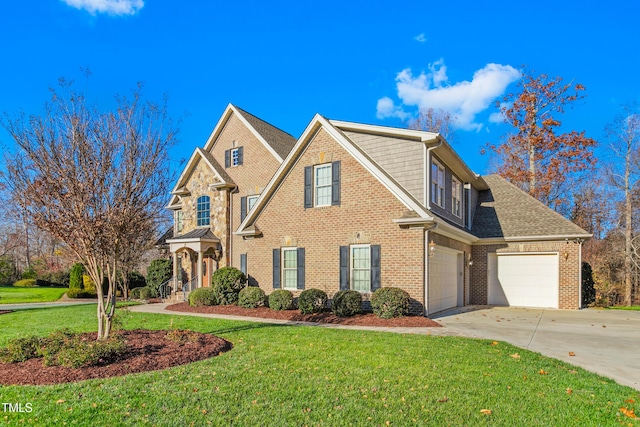 view of front of house with a front yard and a garage