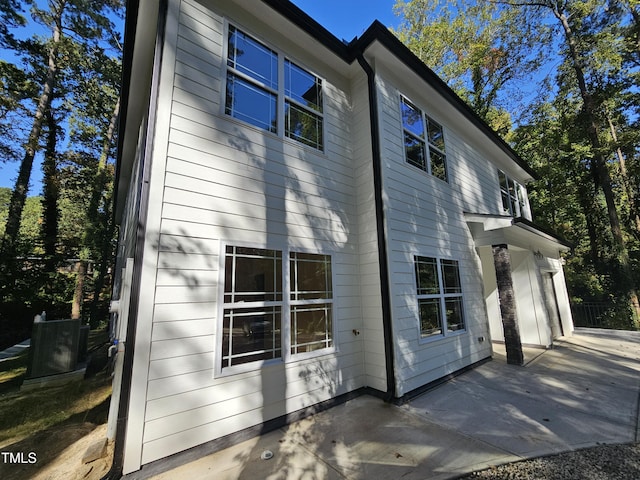 view of side of home featuring a patio