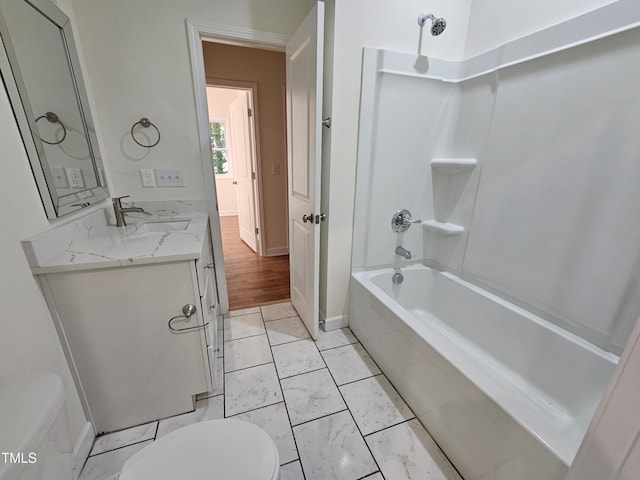 full bathroom featuring vanity, toilet, and tiled shower / bath combo