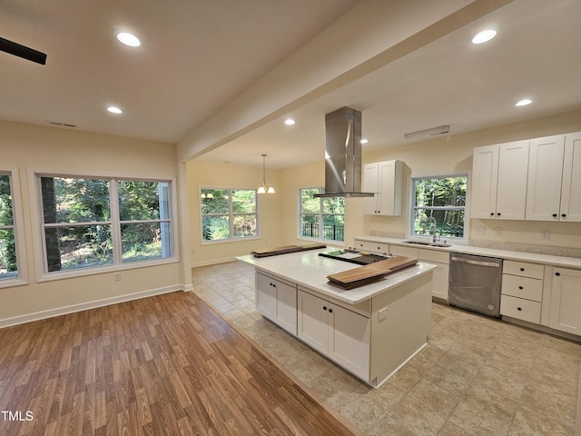 kitchen with light wood-type flooring, white cabinets, island range hood, dishwasher, and a kitchen island