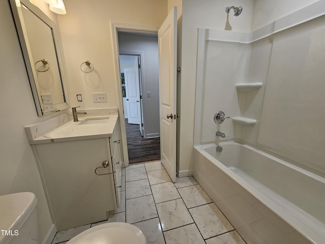 full bathroom featuring vanity, toilet, wood-type flooring, and tiled shower / bath combo