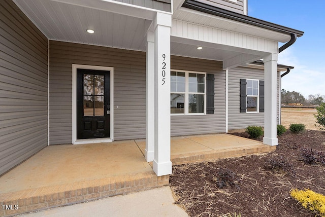 doorway to property with a porch