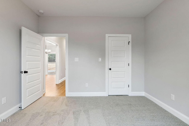 unfurnished bedroom with light carpet