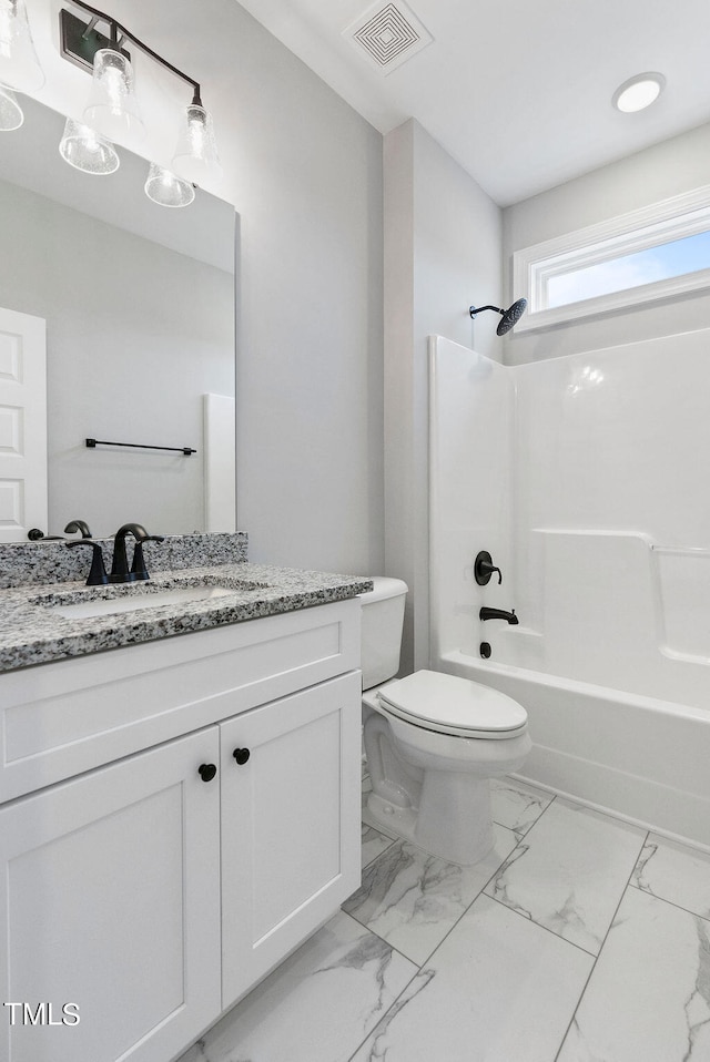 full bathroom featuring vanity, shower / bathtub combination, and toilet