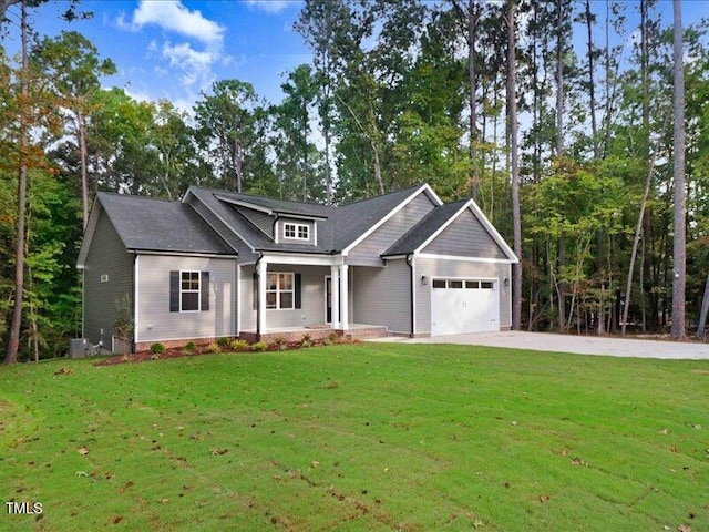 craftsman-style home featuring a garage and a front lawn