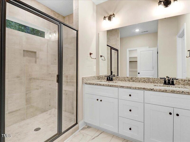 bathroom with vanity and an enclosed shower