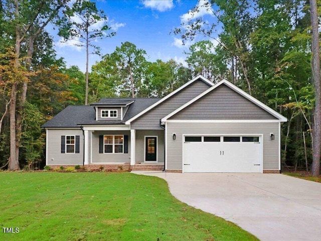 craftsman-style home with a front lawn and a garage