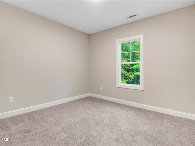 unfurnished room featuring carpet flooring