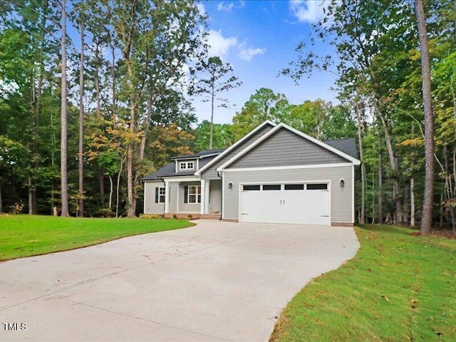 view of front facade with a front yard and a garage