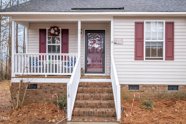 doorway to property with covered porch