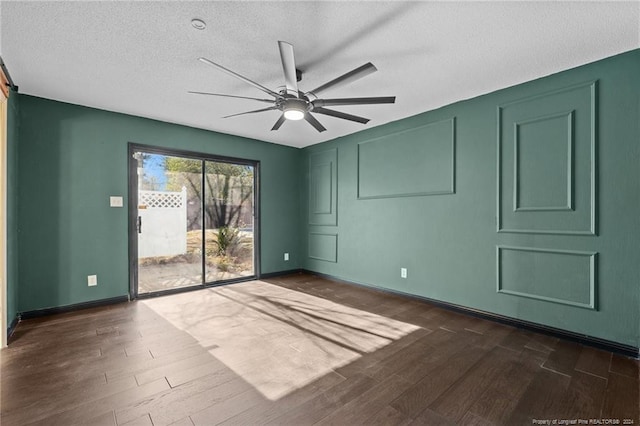 5814 Valhalla Ct, Fayetteville, NC 28304 - spare room with dark wood-style flooring, ceiling fan, a textured ceiling, and baseboards