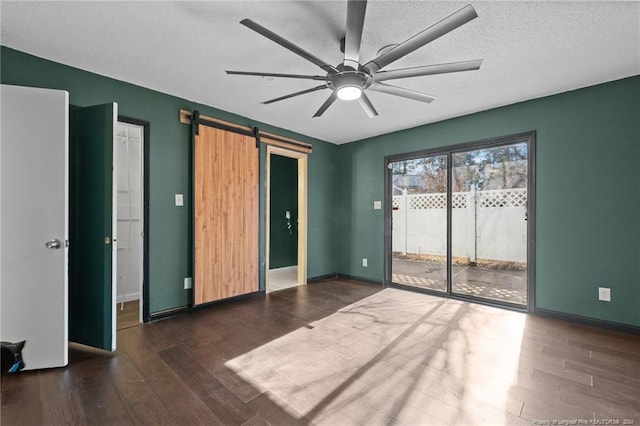 5814 Valhalla Ct, Fayetteville, NC 28304 - unfurnished bedroom with access to outside, a barn door, wood finished floors, baseboards, and ceiling fan
