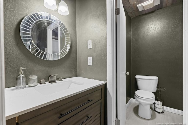5814 Valhalla Ct, Fayetteville, NC 28304 - bathroom with vanity, toilet, baseboards, a textured wall, and tile patterned floors