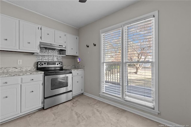 5814 Valhalla Ct, Fayetteville, NC 28304 - kitchen with stainless steel electric range, under cabinet range hood, white cabinetry, baseboards, and light marble finish floors