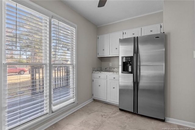 5814 Valhalla Ct, Fayetteville, NC 28304 - kitchen featuring stainless steel fridge with ice dispenser, white cabinetry, baseboards, and crown molding