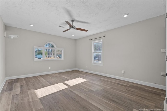 5814 Valhalla Ct, Fayetteville, NC 28304 - empty room featuring a ceiling fan, a textured ceiling, wood finished floors, baseboards, and recessed lighting