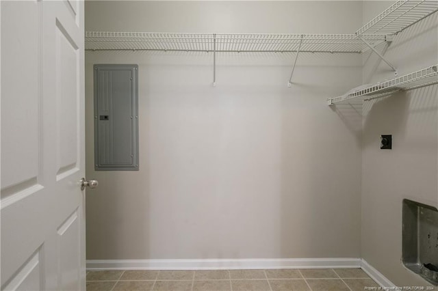 laundry area featuring tile patterned floors, electric dryer hookup, and electric panel