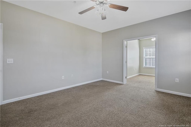 carpeted empty room featuring ceiling fan