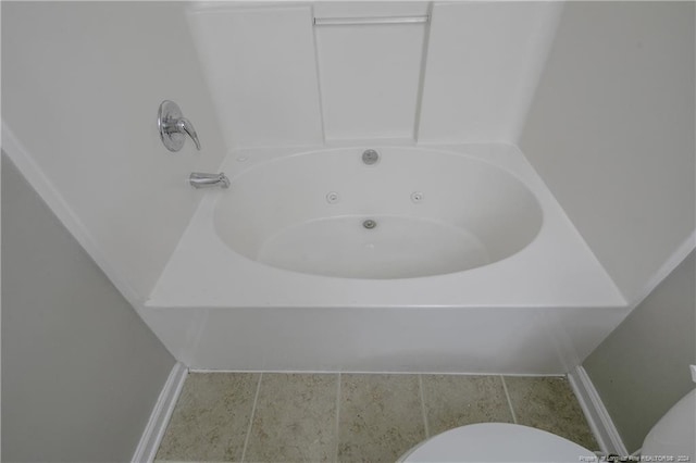 bathroom with tile patterned flooring and toilet