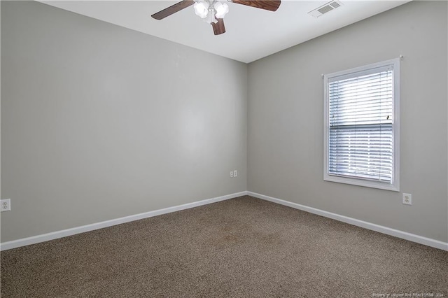 spare room featuring carpet floors and ceiling fan