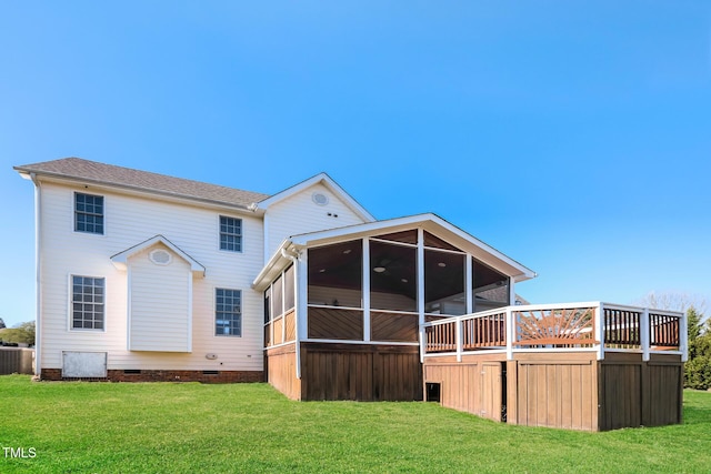 rear view of property with a lawn, a sunroom, and central AC unit