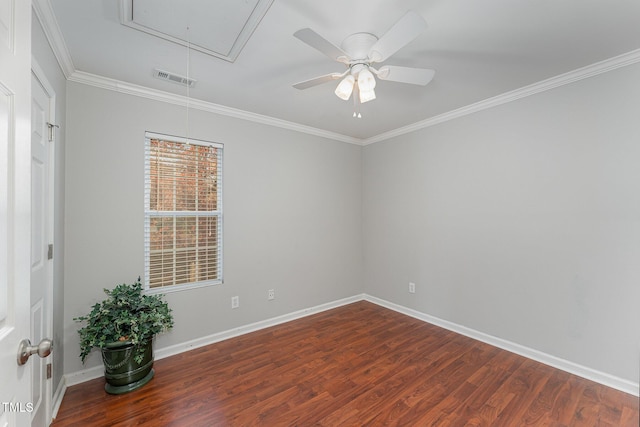 spare room featuring dark hardwood / wood-style flooring, ceiling fan, and ornamental molding