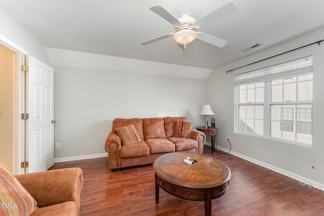 living room with ceiling fan, dark hardwood / wood-style flooring, and lofted ceiling