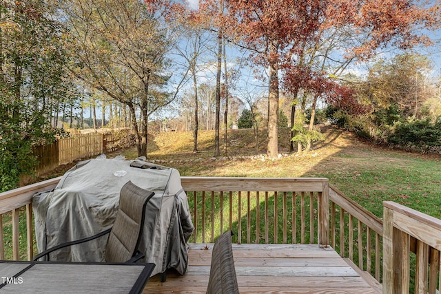 deck with a yard and grilling area