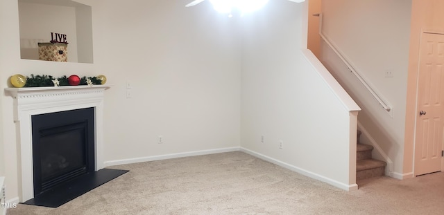 unfurnished living room featuring light carpet