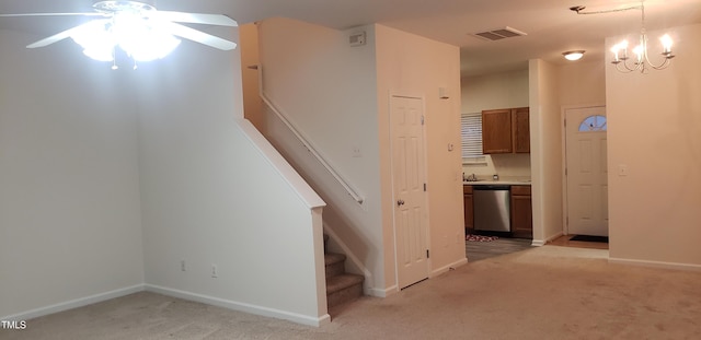 interior space with light colored carpet and a notable chandelier