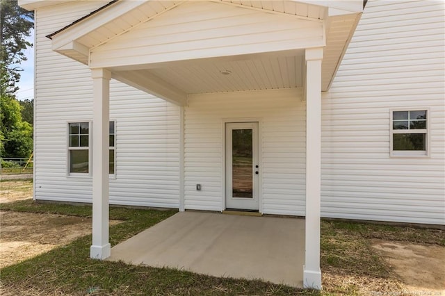 entrance to property featuring a patio area