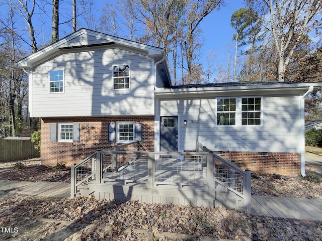 split level home with a wooden deck