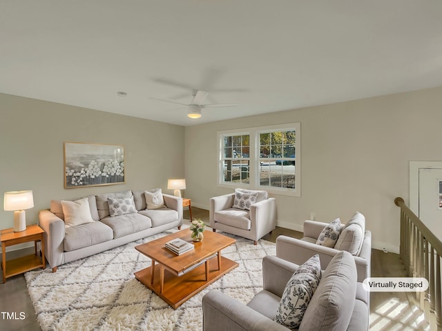 living room featuring ceiling fan and light hardwood / wood-style flooring