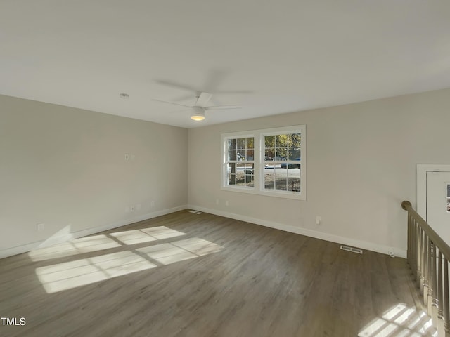 empty room featuring wood-type flooring and ceiling fan