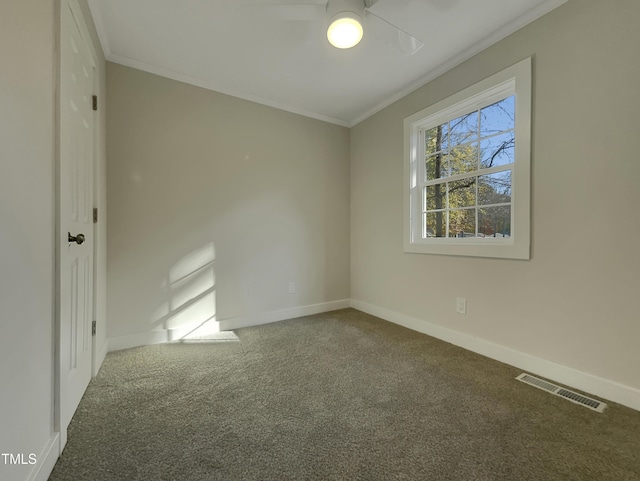 carpeted empty room featuring ornamental molding