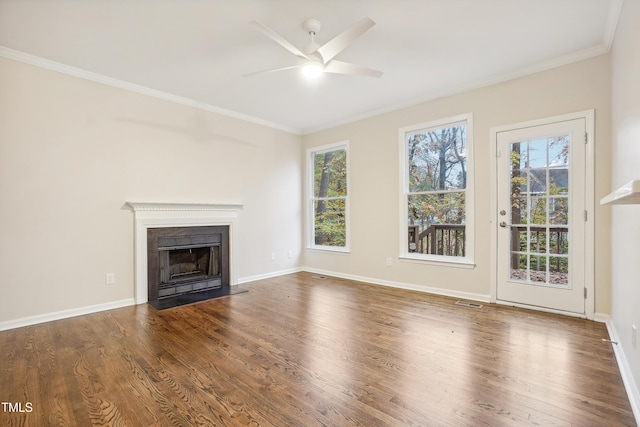 unfurnished living room with ceiling fan, crown molding, and hardwood / wood-style flooring