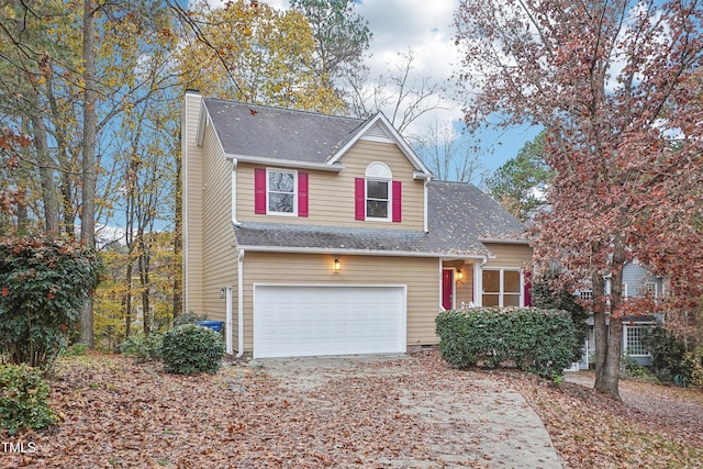 front of property with a garage