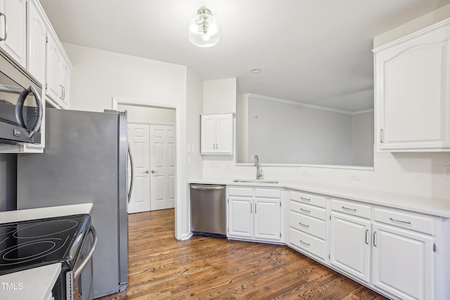 kitchen featuring white cabinets, dark hardwood / wood-style flooring, stainless steel appliances, and sink