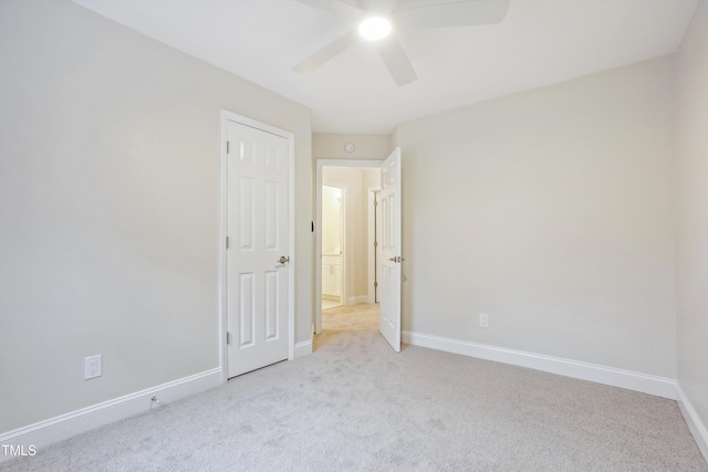 unfurnished bedroom with ceiling fan and light carpet