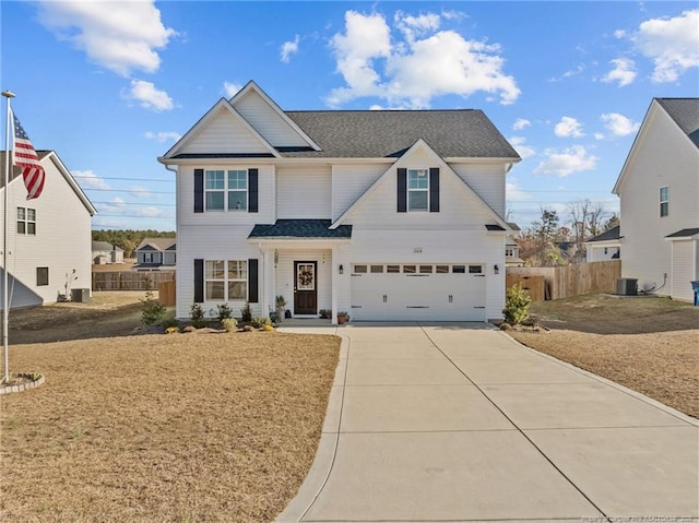 front of property featuring a garage and central AC unit