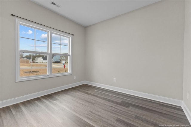 empty room featuring wood-type flooring