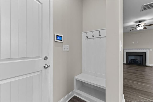 mudroom with dark wood-type flooring and ceiling fan