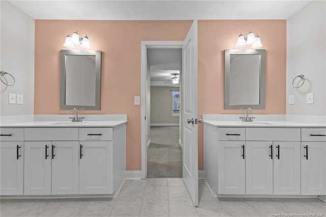 bathroom with ceiling fan and vanity