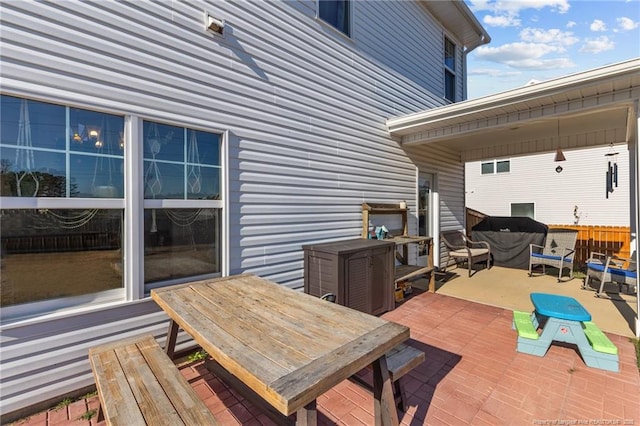 wooden deck with a patio