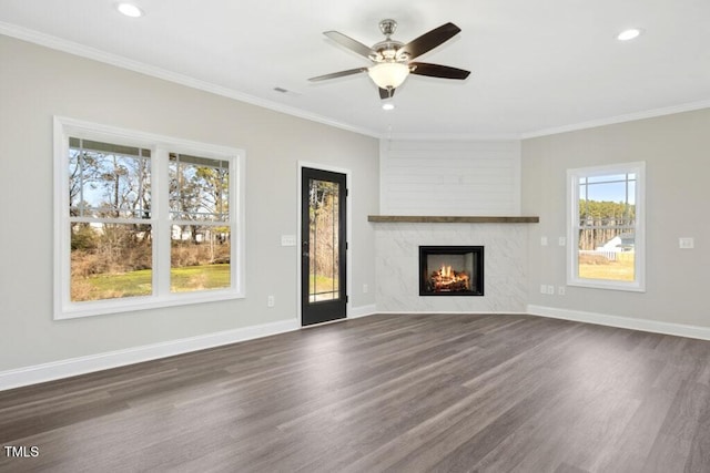 unfurnished living room featuring dark hardwood / wood-style flooring and crown molding