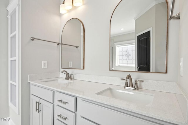 bathroom featuring vanity and crown molding